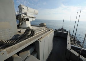 The Afloat Forward Staging Base (Interim) USS Ponce (ASB(I) 15) conducts an operational demonstration of the Office of Naval Research (ONR)-sponsored Laser Weapon System (LaWS) while deployed to the Persian Gulf in 2014. (Photo: U.S. Navy by John F. Williams/Released)