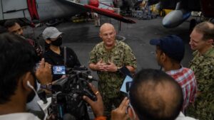 Adm. Mike Gilday, Chief of Naval Operations, addresses media in the hangar bay of Nimitz-class aircraft carrier USS Carl Vinson (CVN-70) as part of MALABAR 2021, Oct. 14, 2021. (Photo: U.S. Navy by Mass Communication Specialist Seaman Emily Claire Bennett)