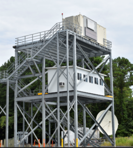 A 40-foot tower constructed at Naval Surface Warfare Center Dahlgren Division (NSWCDD) is topped by a radar prototype used in foreign comparative testing. The middle-level contains a command and control room. This effort supports the Navy’s Future X-Band Radar program, with the tower acting as a proxy for a ship’s radar mast. (Photo: U.S. Navy)