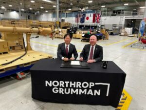 Masahiko Arai, corporate executive, group senior vice president, defense and space systems at Mitsubishi Electric Corporation and Ian Reynolds, vice president for C4 missile defense business unit at Northrop Grumman sign a teaming agreement at the Huntsville Manufacturing Center. (Photo: Northrop Grumman)