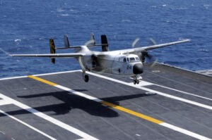 A C-2A Greyhound assigned to the Providers of Fleet Logistics Support Squadron 30 lands aboard the aircraft carrier USS Nimitz in July 2020. (Photo: U.S. Navy by Mass Communication Specialist 3rd Class Peter Merrill)