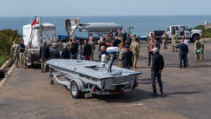 Military and industry representatives view a Large Diameter Unmanned Underwater Vehicle (LDUUV), Global Autonomous Reconnaissance Craft (GARC), and an M18 Unmanned Surface Vehicle (USV) on display as part of Integrated Battle Problem (IBP) 24.1 at U.S. 3rd Fleet in San Diego, March 14, 2024. (Photo: U.S. Navy by Mass Communication Specialist 2nd Class Lily Gebauer)