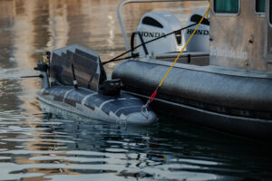 Mariners tow a Triton unmanned surface vessel (USV) to sea in the waters off San Diego during Integrated Battle Problem (IBP) 24.1, March 08, 2024. (Photo: U.S. Navy by Ian Delossantos)