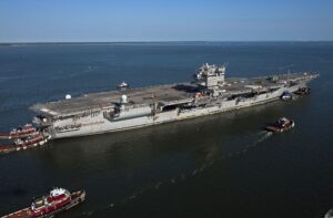 The aircraft carrier USS Enterprise (CVN-65) makes its final voyage to HII Newport News Shipbuilding, Va. in June 2013. (Photo: Huntington Ingalls Industries by John Whalen/Released)