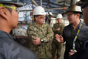 Brandin Lawrence, Submarine Survey (Inspection/Repairs) Branch Head at Pearl Harbor Naval Shipyard and Intermediate Maintenance Facility (PHNSY & IMF), talks to Rear Adm. Jonathon Rucker, Program Executive Office, Attack Submarines (PEO SSN), during a tour of USS Illinois (SSN 786) at PHNSY & IMF in Nov. 2024 (Photo: U.S. Navy by Justice Vannatta)